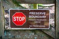 `Stop; Preserve Boundary; Private Boundary Ahead; No Trespassing` Sign