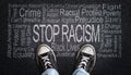 Stop Racism Word Cloud on Asphalt Concept of Fighting Discrimination Royalty Free Stock Photo