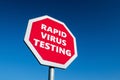Stop for Rapid COVID-19 Virus Testing transportation sign in perspective view Royalty Free Stock Photo