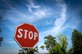 Stop Road Sign on Blue sky with Clouds - Rural Scene Photography Royalty Free Stock Photo