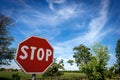 Stop Road Sign on Blue sky with Clouds - Rural Scene Photography Royalty Free Stock Photo