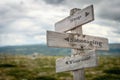 stop sabotaging yourself text engraved on old wooden signpost outdoors in nature