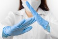 Stop SARS-CoV, SARSCoV, virus 2020 , MERS-CoV ,chinese virus COVID-19. Closeup womans hands in blue medical gloves show STOP sign.