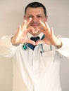 COVID-19. Male doctor`s hands show a heart sign. HIV protection concept. Doctor shows a heart symbol. Healthcare Royalty Free Stock Photo