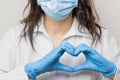 Stop SARSCoV, virus 2020 , MERS-CoV, chinese virus COVID-19.  Womens hand in blue medical gloves show heart sign. Concept of Royalty Free Stock Photo