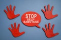 Stop self sabotage sign and wooden hands.