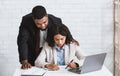 Stop sexual harassment. Perverted African American boss touching his attractive female assistant at office Royalty Free Stock Photo