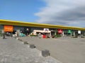 Stop shop shopping center, Sremska Mitrovica, Serbia, June 06, 2022. Square with open shops dm, intersport, dekordom