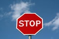 Stop sign against cloudy sky. Royalty Free Stock Photo