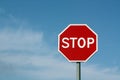 Stop sign against cloudy sky. Royalty Free Stock Photo