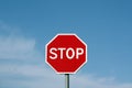 Stop sign against cloudy sky. Royalty Free Stock Photo