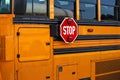 Typical yellow American school bus with stop signs Royalty Free Stock Photo