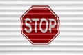 Stop Sign On The Automatic Aluminum Garage Gate Royalty Free Stock Photo