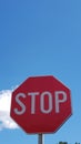 Stop sign on a clear blue skye background