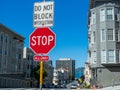 Stop sign do not block interaction hanging on post in urban city Royalty Free Stock Photo