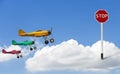 The stop sign is embroidered on clouds and models of vintage military propeller plane model with a clipping path Royalty Free Stock Photo