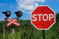 Stop sign in front of a railway crossing Royalty Free Stock Photo