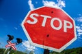 Stop sign in front of a railway crossing Royalty Free Stock Photo