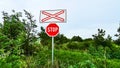 A STOP sign in front of a railway crossing. Royalty Free Stock Photo