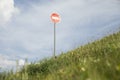Stop sign on Green Mountain. Traffic Restriction Road Sign. Hill Pointer Royalty Free Stock Photo