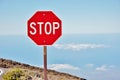 Stop sign above clouds