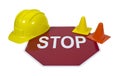 Stop Sign with Hard Hat and Safety Cones Royalty Free Stock Photo