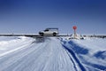 Stop Sign at Intersection in Winter Snowy Road Royalty Free Stock Photo