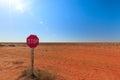 Stop sign for priority road in the middle of Witjira National Park where there is no road to be seen