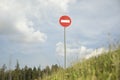 Stop sign on mountain. Road sign on hill. Round plate Royalty Free Stock Photo