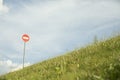 Stop sign on mountain. Road sign on hill. Round plate