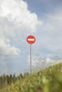 Stop sign on mountain. Road sign on hill. Round plate