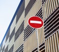 Stop sign near new parking building, empty street nobody concept Royalty Free Stock Photo