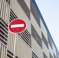 Stop sign near new parking building, empty street nobody concept Royalty Free Stock Photo