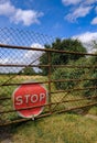 Road Stop Sign seen fitted to a farm gate entrance.