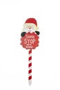 Stop Sign. Red Stop Sign with Santa Hat. Decoration sign Santa Claus Stop here in red isolated on a white background. Christmas Royalty Free Stock Photo