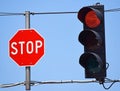 Stop sign and red traffic light Royalty Free Stock Photo