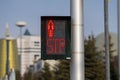 Stop sign. Traffic light located within the city limits shows a red forbidding signal for crosswalk traffic Royalty Free Stock Photo