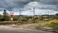 Stop sign, unguarded railroad crossing in Walbrzych, in the distance you can see the mountains Royalty Free Stock Photo