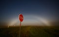 STOP sign and visible moonbow Royalty Free Stock Photo