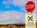 Stop SignAt Private Railroad Crossing With Train In Background Royalty Free Stock Photo