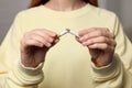 Stop smoking concept. Woman breaking cigarette on light gray background, closeup Royalty Free Stock Photo