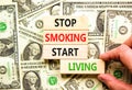 Stop smoking start living symbol. Concept words Stop smoking start living on cubes. Beautiful background from dollar bills. Doctor