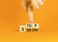 Stop smoking symbol. Concept words Stop smoking on wooden cubes. Beautiful orange table orange background. Doctor hand. Medical, Royalty Free Stock Photo