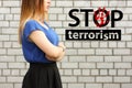 Stop terrorism concept. girl on a brick wall Royalty Free Stock Photo