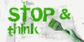 stop and think sign in green with paintbrush. lifestyle business eco concept Royalty Free Stock Photo