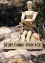 Stop Think Then act Written on wooden surface