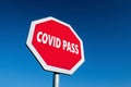 Stop traffic sign protesting against Covid Pass which will be needed for travelling in the coronavirus crisis Royalty Free Stock Photo