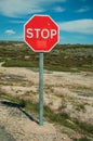 STOP traffic signpost and rocky landscape Royalty Free Stock Photo