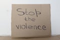 Stop the violence cardboard sign. The concept of the world without violence