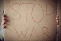 Stop war inscription on cardboard paper in female hands Royalty Free Stock Photo